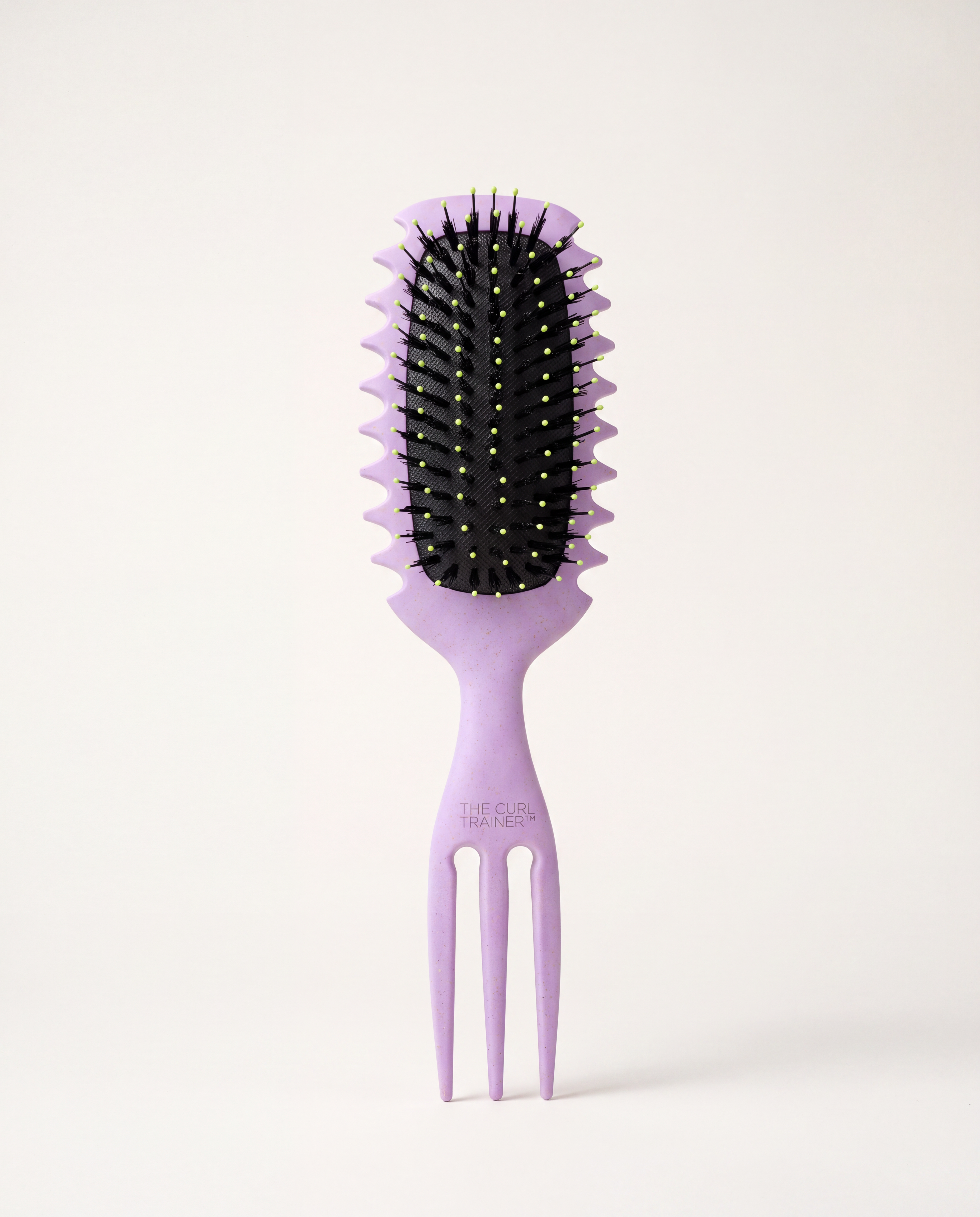 The Curl Trainer PRO curl defining brush in lavender, front view with clumping guide grooves and built-in volume pick