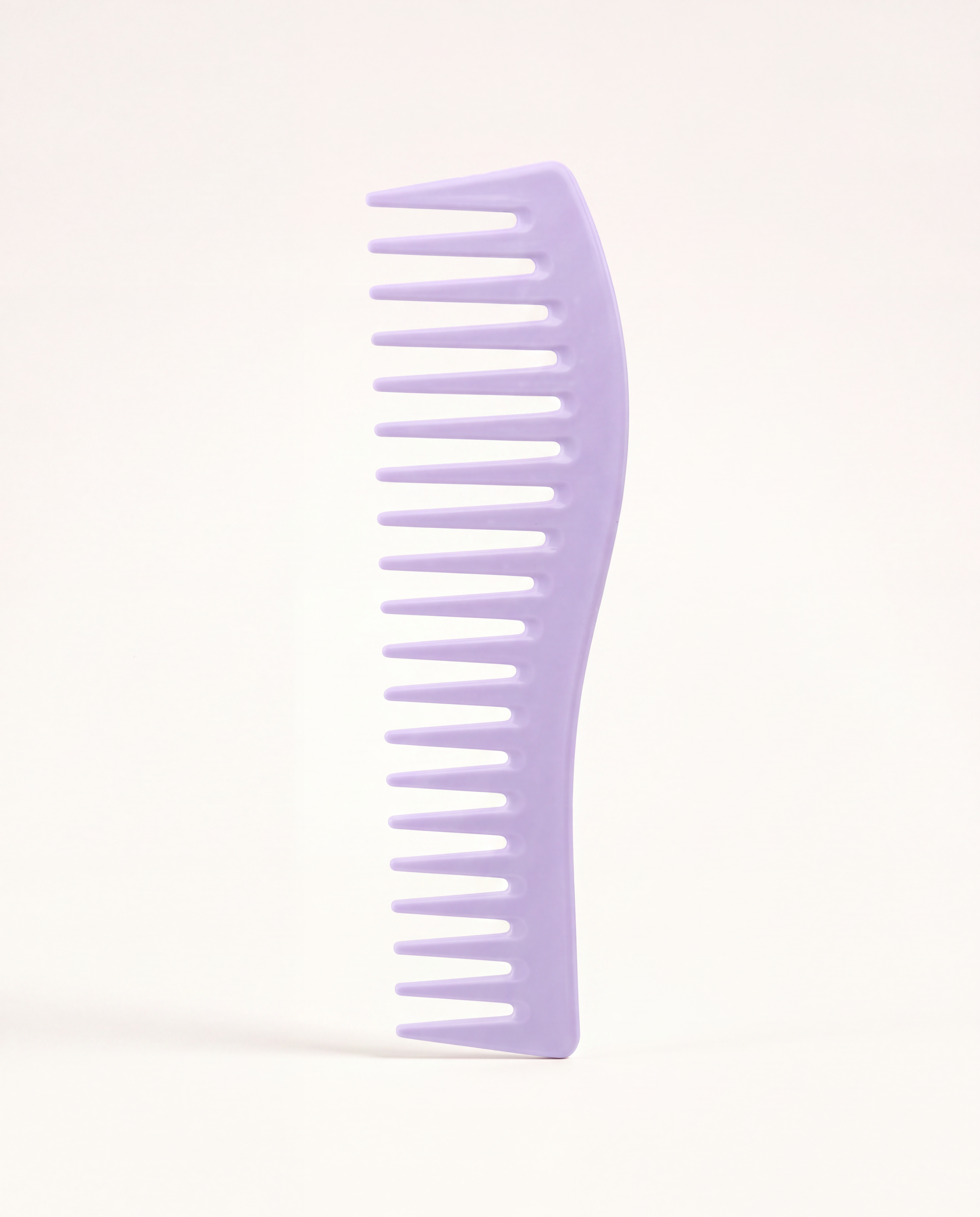 Essential Wide-Tooth Detangling Comb in lavender, standing upright to show its widely spaced teeth